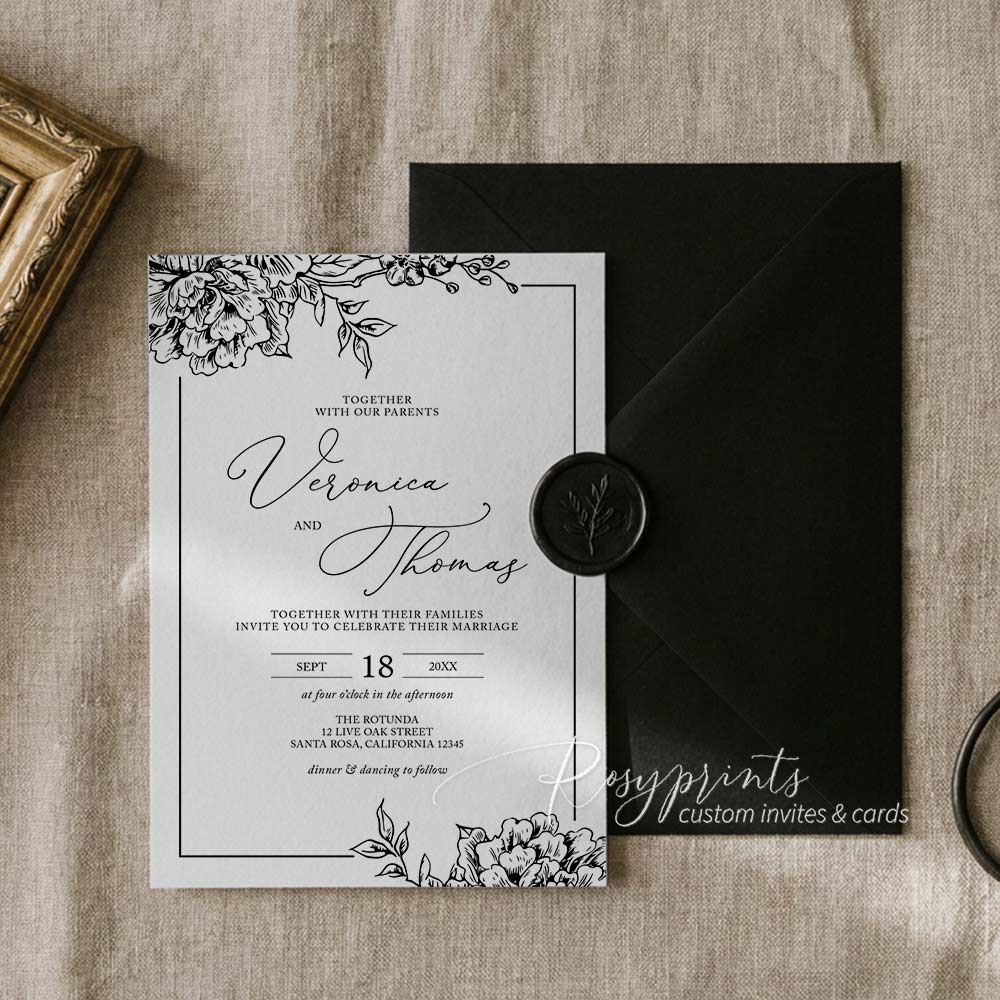black and white garden floral vellum wrapped wedding invitations