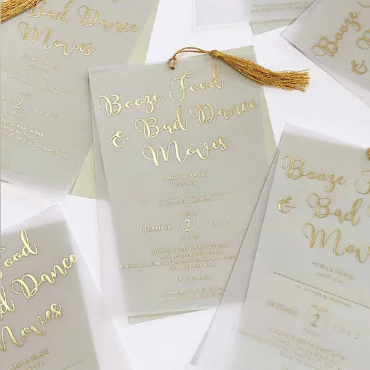 gold foil save the date cards with vellum overlay and tassel 