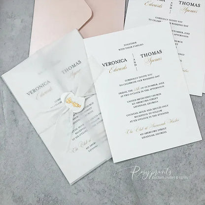 elegant white wedding invitation w/ vellum wrap ribbon and wax seal 